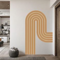 a room with a large wall decal in the shape of a letter p