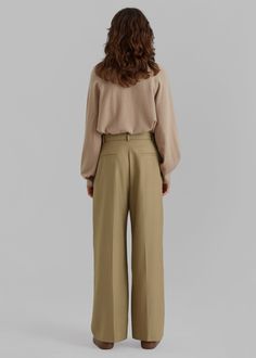 Color: TaupeMidweight woven wool blend fabricRelaxed silhouettePleat front detailDetachable fabric beltWide legFront pleat detailing Traveler's creaseSlant hip pocketsHook and bar closureUnlined50% Wool 50% PolyesterLining: 100% PolyesterDry CleanImported Wide Leg Pants With Concealed Front For Work, Chic Wide Leg Bottoms With Concealed Fastening, Workwear Straight Pants With Concealed Front Fastening, Formal Wide-leg Pants With Belted Cuffs, Chic Office Bottoms With Concealed Front Fastening, Chic Bottoms With Concealed Front Fastening For Office, Chic Wool Workwear Bottoms, Chic Wool Bottoms For Work, Formal Beige Wide Leg Pants With Belt Loops