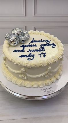 a white cake with blue writing on it