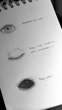 an open notebook with drawings of eyes and the words monsters are real, they live inside us and sometimes win