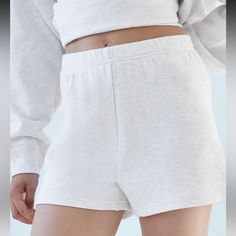 These Are High-Rise Sweatshorts With An Elastic Waist. They're Made With Tna’s Airy Fleece Layer-Friendly, Drapey French Terry. Our Je-Ne-Sais-Quoi Lightweight. Basic Relaxed Fit Shorts, Basic Relaxed Fit Short Length Activewear, White Leisure Shorts, White Sporty Pajama Shorts With Relaxed Fit, White Relaxed Fit Pajama Shorts Athleisure, White Sporty Relaxed Fit Pajama Shorts, White Relaxed Fit Pajama Shorts For Leisure, Sporty White Relaxed Fit Pajama Shorts, Comfortable White Athletic Shorts For Loungewear