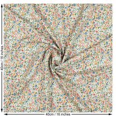 an image of a white fabric with colorful sprinkles and flowers on it