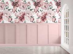 an empty room with pink flowers on the wall and wooden floors, painted in pastel tones