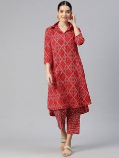 Women Bandhani Printed Panelled Pure Cotton Kurta with Trousers Product Details: Red printed Kurta with Trousers Kurta design: Bandhani printed A-line shape Panelled style Shirt collar, three-quarter regular sleeves Calf length length with high-low hem Pure cotton machine weave fabric Trousers design: Printed Trousers Elasticated waistband Drawstring closure Size & Fit The model (height 5'8) is wearing a size S Material & Care Kurta fabric: Cotton Bottom fabric: Cotton Machine Wash Specification Ankle-length Printed Motifs Salwar Kameez, Red Bandhani Print Palazzo Set With Traditional Drape, Red Traditional Wear With Printed Motifs For Transitional Season, Red Bandhani Print Palazzo Set For Festivals, Red Bandhani Print Palazzo Set For Festive Occasions, Red Bandhani Print Palazzo Set For Navratri, Festive Red Palazzo Set With Bandhani Print, Red Sets With Printed Motifs In Traditional Drape, Red Traditional Drape Sets With Printed Motifs