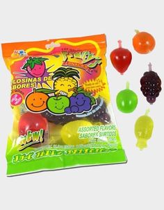 an assortment of gummy candies in a bag with fruit on the top and two different flavors