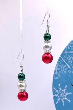 Merry Christmas and happy holidays!  Enjoy these beautiful, dangle, Christmas earrings!  So fun for the holidays!  Give as a gift or keep as a gift to yourself!  Free shipping  Sturdy, festive and fun!  So pretty with any Christmas décor!  Handmade by me.  I take great pride and care with every piece of jewelry I create! Christmas Festive Beaded Dangling Earrings, Holiday Beaded Earrings As Gift, Festive Beaded Holiday Jewelry, Beaded Earrings For Holiday Gifts, Christmas Party Beaded Dangling Earrings, Christmas Beaded Jewelry Gift, Beaded Jewelry Christmas Gift, Holiday Beaded Dangle Earrings, Christmas Party Dangling Beaded Earrings