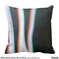 a black pillow with multicolored lines on it