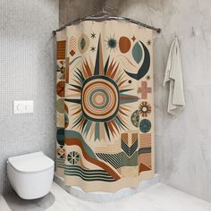 a bathroom with a shower curtain that has an image of the sun and planets on it