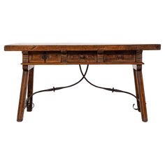 an old wooden table with two drawers on one side and wrought iron legs at the bottom