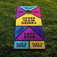 a colorful cornhole board with the words drink and other team drinks on it in different colors