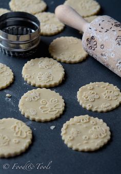 some cookies and a rolling pin on a table