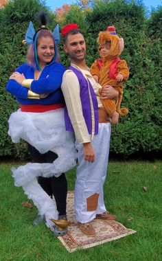 a man and woman dressed up as disney characters