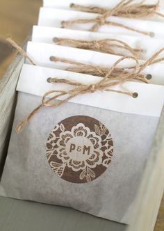 some brown and white envelopes tied up with twine on top of each other