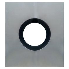 a round metal object with a white background