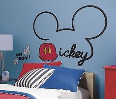 a mickey mouse wall decal with the word mickey on it