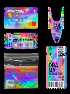 four different types of plastic id cards with rainbow colors and smiley faces on the front