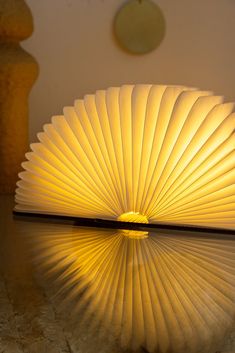 an illuminated book sitting on top of a table