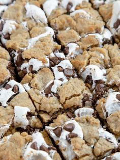 a close up of a cookie with chocolate chips and marshmallows