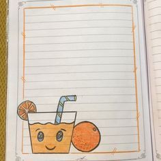 a notebook with an orange juice and a straw