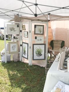 an outdoor tent with paintings and pictures on it