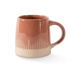 a brown and white coffee mug with lines on it's side, sitting in front of a white background