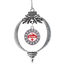 a christmas ornament with the flag of portugal hanging from a silver ball chain