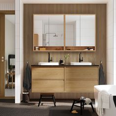 a bathroom with two sinks and a large mirror over it's bathtub area