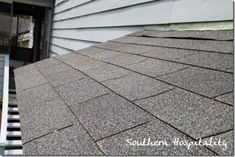 the roof of a house that has been gutted and is missing shingles on it