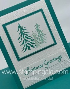 a christmas card with green and white trees on the front, which reads stampin'up