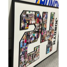 a white and black sign with the number fifty five surrounded by pictures of people in it