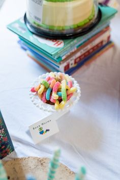 there is a cake and candy on the table