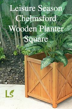 a wooden planter with plants in it and the words leisure season chemsford wooden planter square