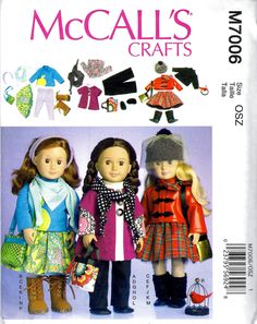 two dolls are standing next to each other in front of an advertisement for mccall's crafts