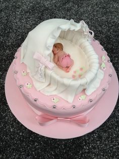 a pink cake with a baby in it