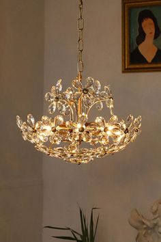 a chandelier hanging from the ceiling in a living room