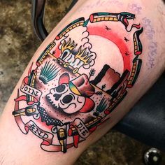 a man with a tattoo on his leg that has a skull and firefighters around it