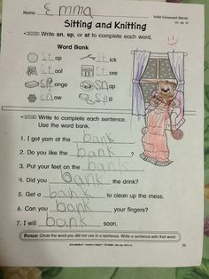 a child's handwritten worksheet with words and pictures on it, including an image of a cat