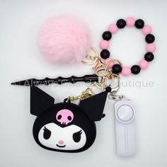 Introducing the Black Kuromi Guardian Safety Keychain – where edgy style meets practical security in a striking fusion. This keychain isn't just an accessory; it's a comprehensive safety companion designed to infuse a touch of Black Kuromi's boldness into your daily ventures. Securing your keys with flair, the keychain features a silicone bead wristlet for a stylish and reliable hold. The heart-shaped faux fur pom-pom adds an edgy charm to your ensemble, ensuring you stand out with both attitude Trendy Black Keychains, Trendy Black Keychain With Key Leash, Black Kuromi, Black Keychain With Key Leash For Personal Use, Safety Keychain, Silicone Bead Wristlet, Personal Safety, Edgy Style, Wristlet Wallet