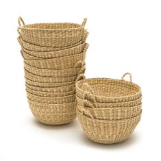 several woven baskets stacked on top of each other