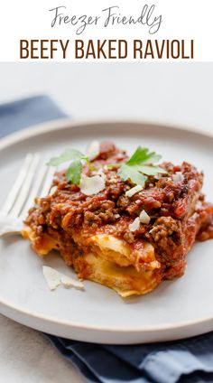 a white plate topped with meaty baked ravioli