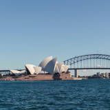 the sydney opera house and harbour bridge are seen from across the water