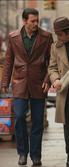 two men walking down the street holding hands