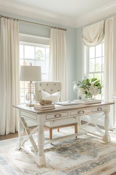 a white desk sitting in front of two windows with curtains on either side of it