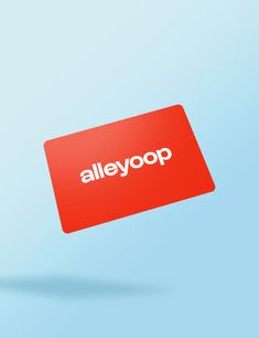 a red alleygop sign flying through the air in front of a blue background