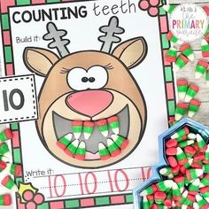 a christmas themed counting game with candy in front of it and an image of a reindeer