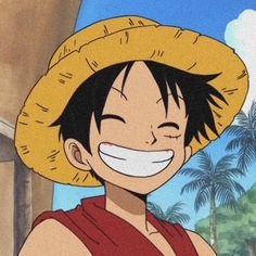 one piece is smiling and wearing a straw hat