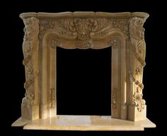 a white marble fireplace surround with carvings on it