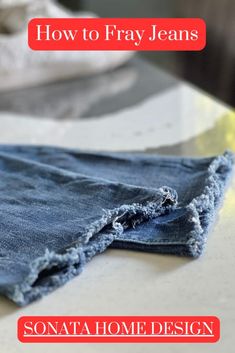 an old pair of jeans with the words how to fray jeans on it, sitting on top of a table