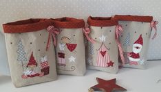 three christmas bags with gnomes and stars on them