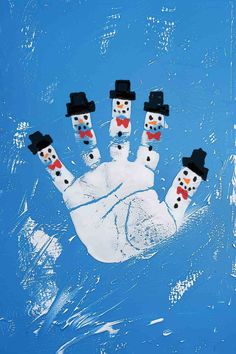 a hand with three snowmen painted on it in the shape of a man's hand